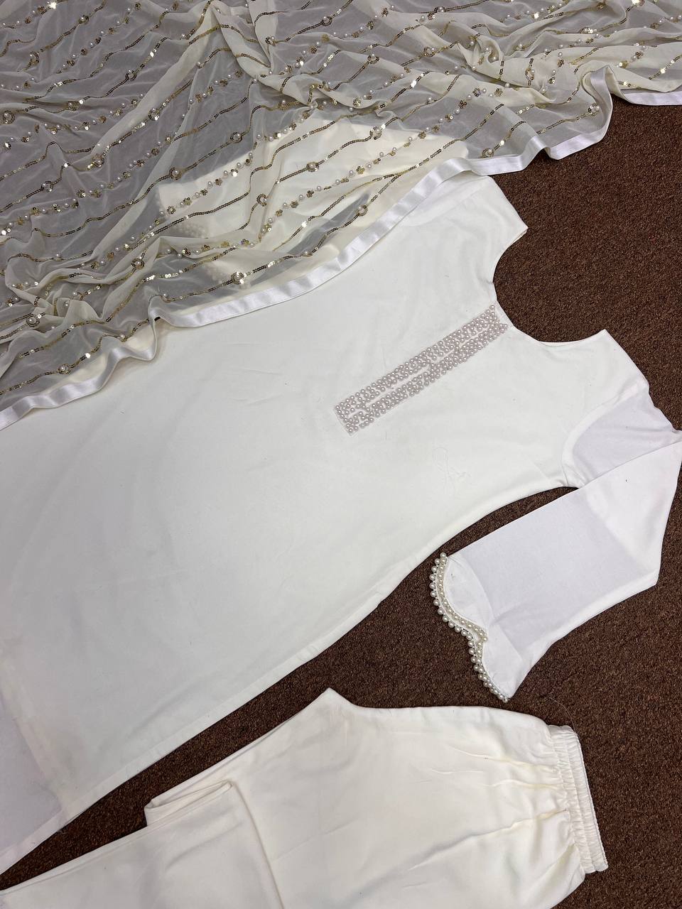 Beautiful Suit Set With Fancy Stitching Riveted Moti Work